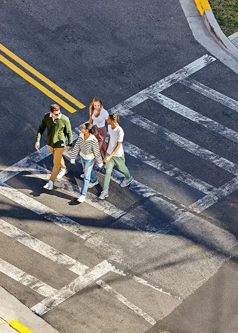 friends crossing a street