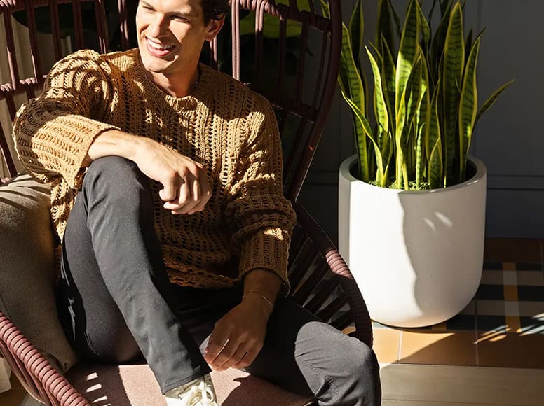 a man sitting and smiling