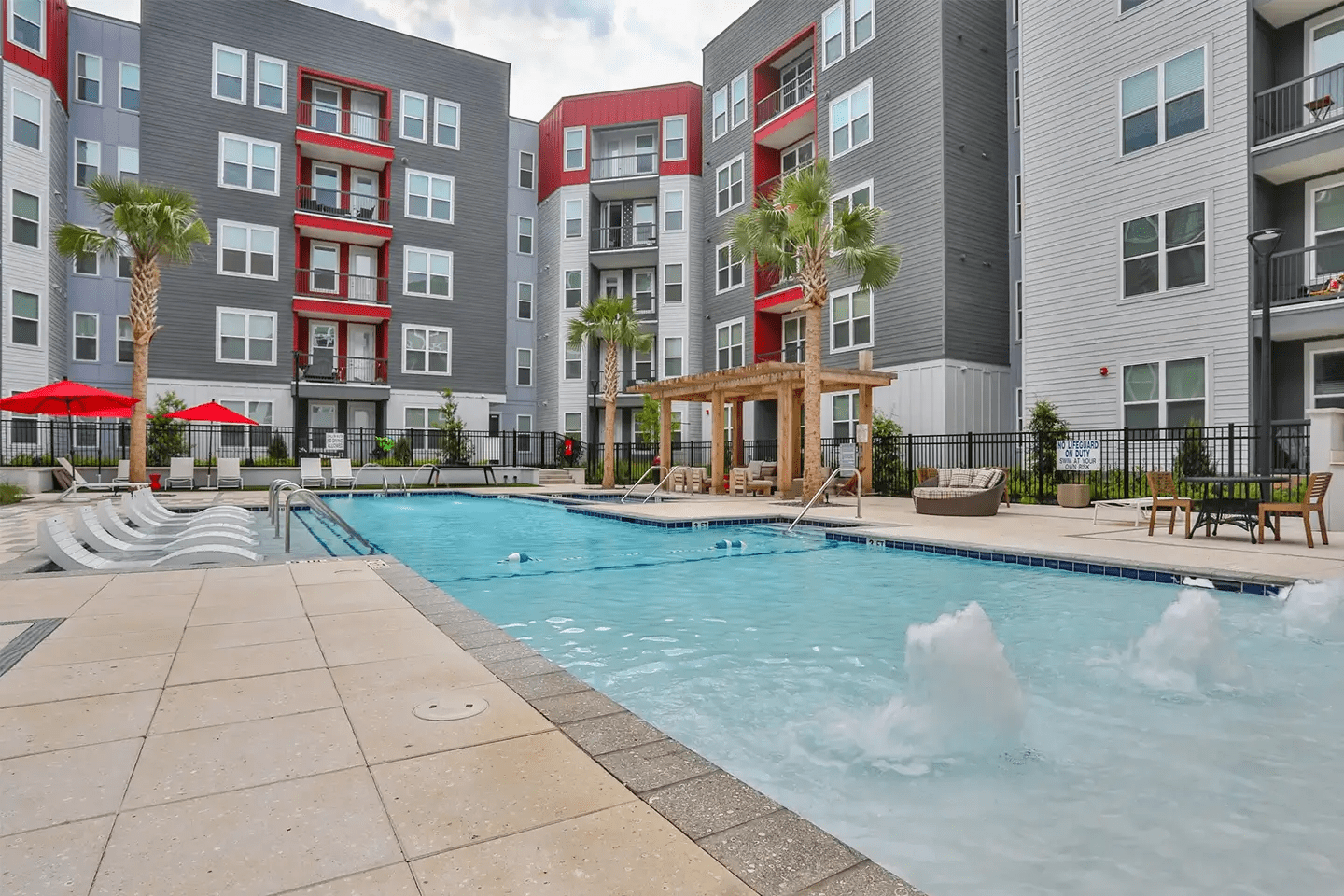 Outdoor pool and deck with seating